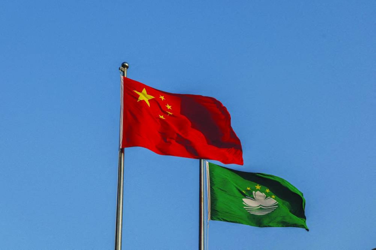 Chinese and Macau flags flutter at the Golden Lotus Square in Macau, China. (Reuters/File Photo)
