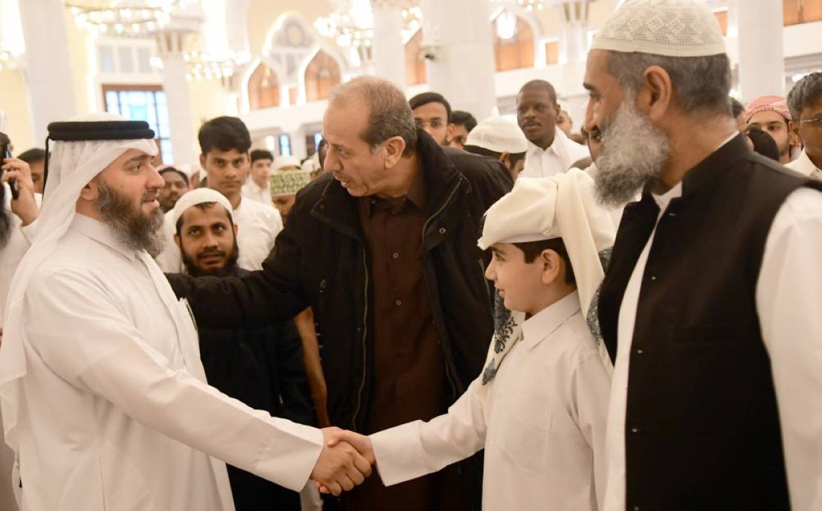 Worshippers exchange Eid greetings.