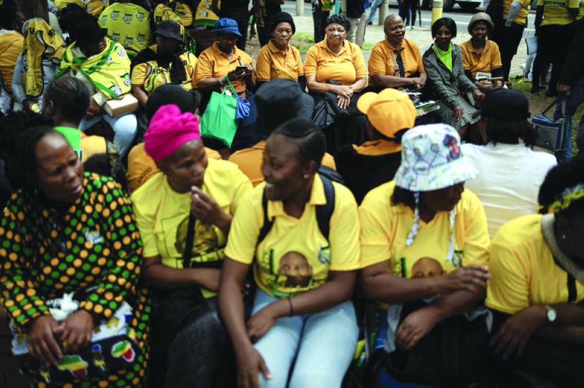 Supporters gather before the "People’s March,” led by the African National Congress (ANC) in defence of the country’s sovereignty and democratic gains in Johannesburg on March 21, 2026. Thousands marched in Johannesburg in a show of sovereignty following pressure from the US, as the demonstration coincides with Human Rights Day and marks 30 years since the adoption of the South African Constitution. (AFP)