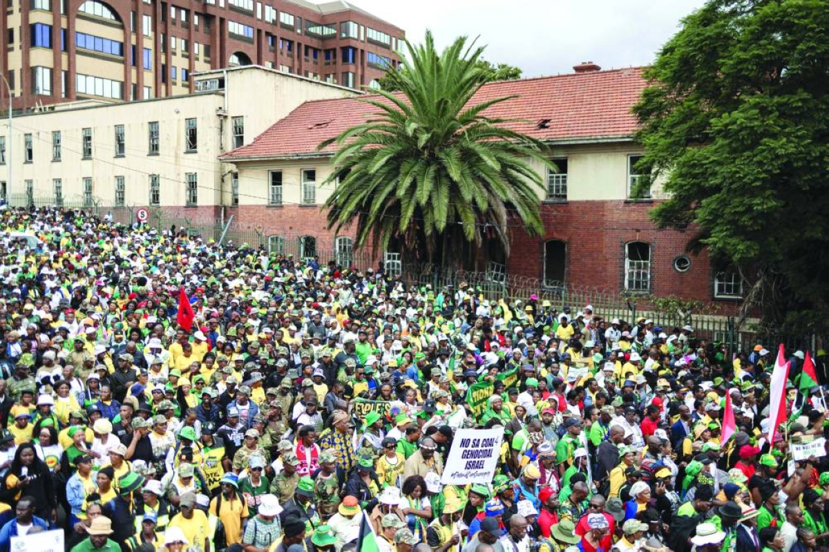 Supporters march during the "People’s March,” led by the African National Congress (ANC) in defence of the country’s sovereignty and democratic gains in Johannesburg on March 21, 2026. Thousands marched in Johannesburg in a show of sovereignty following pressure from the US, as the demonstration coincides with Human Rights Day and marks 30 years since the adoption of the South African Constitution. (AFP)