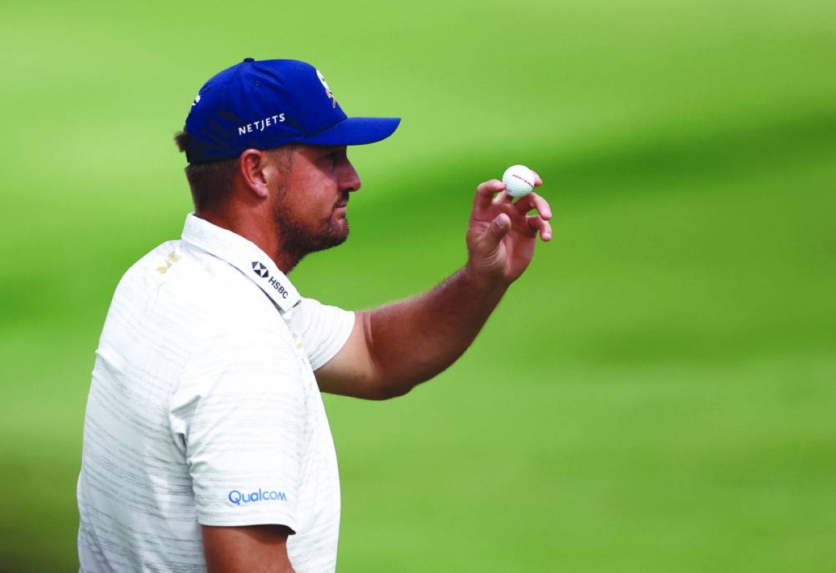 Bryson DeChambeau acknowledges fans during the third round of the LIV Golf event in South Africa Saturday. (Reuters)