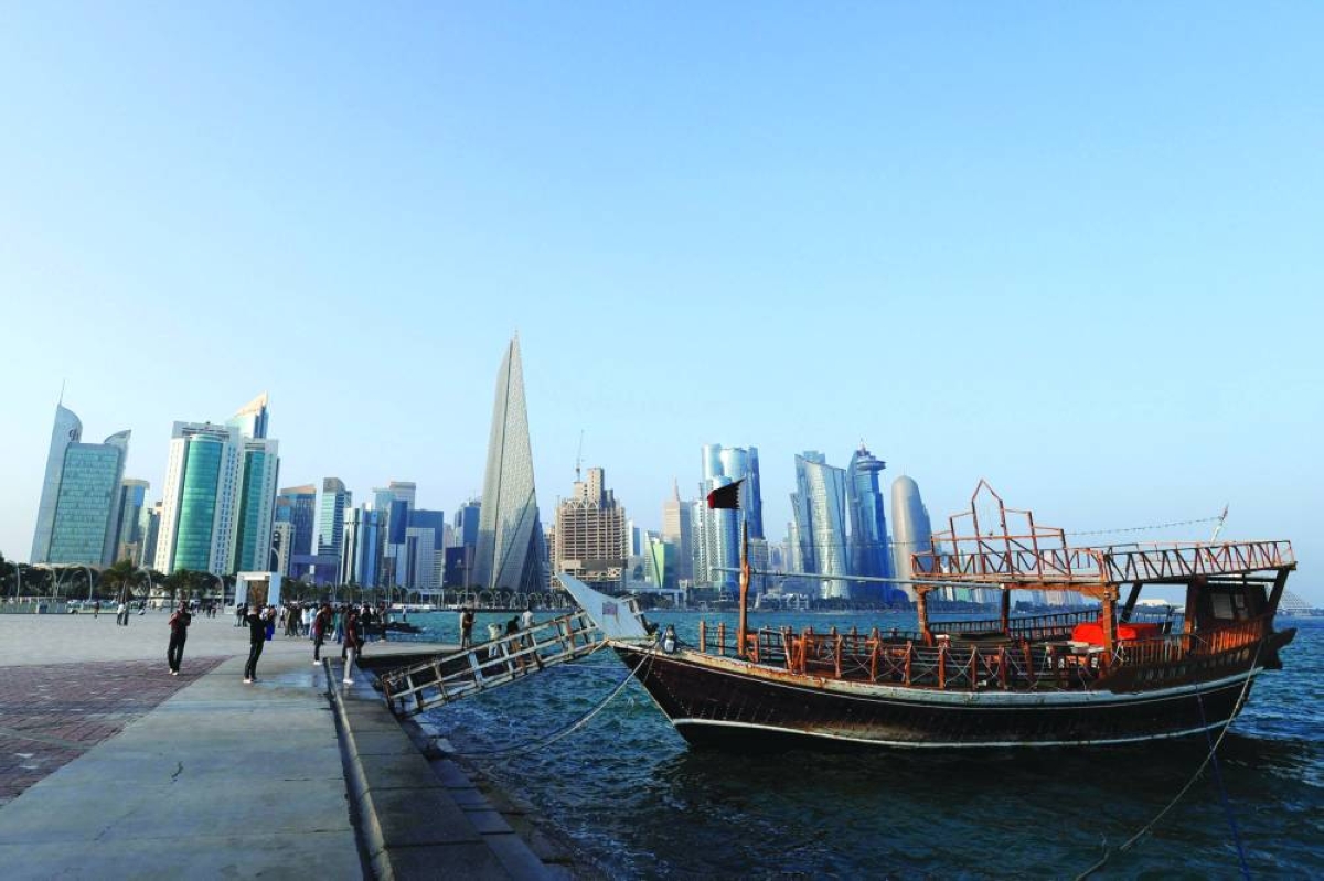 People walk along the Corniche on the second day of Eid al-Fitr celebrations. – AFP