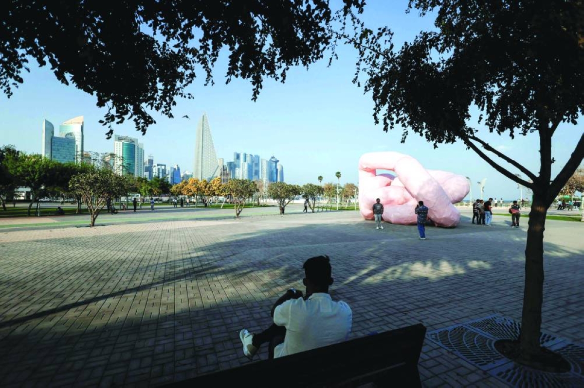 A man sits looking at the Gekrose sculpture (2011) by late Austrian artist Franz West along the Corniche Saturday. – AFP
