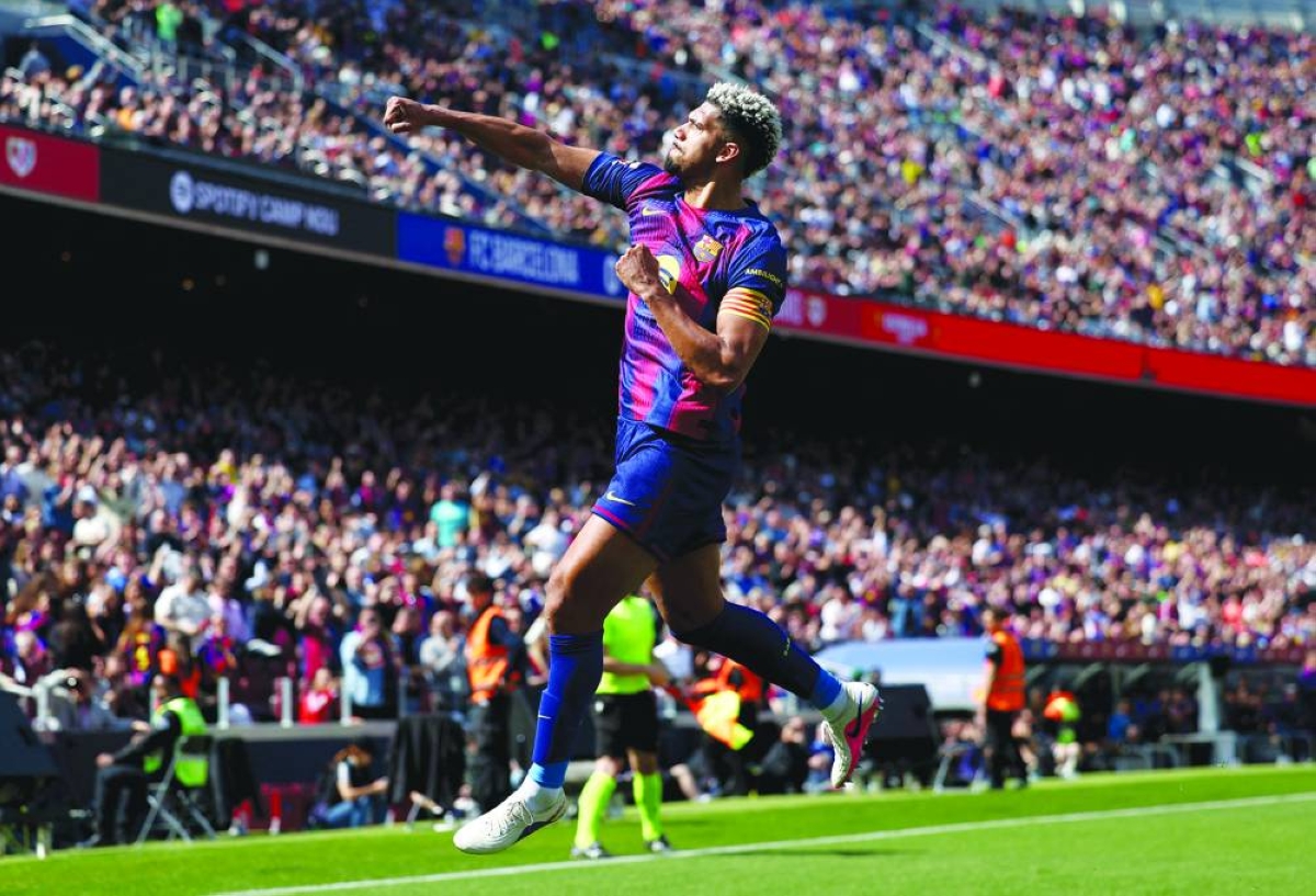 Barcelona's Uruguayan defender #04 Ronald Federico Araujo da Silva celebrates scoring his team's first goal during the Spanish league football match between FC Barcelona and Rayo Vallecano de Madrid at Camp Nou Stadium in Barcelona on March 22, 2026. (AFP)
