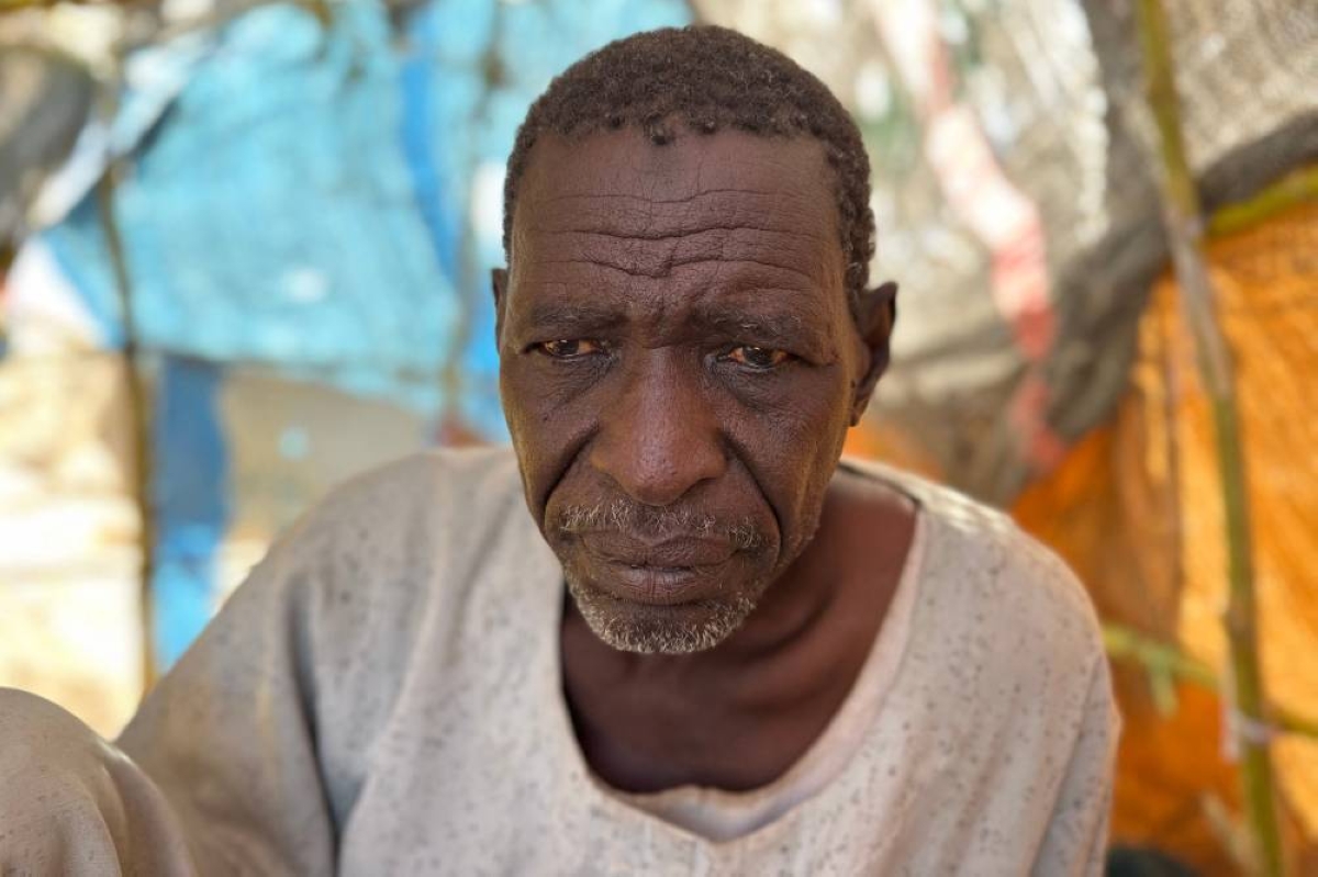 File photo shows Sudanese displaced Ahmed Aman sitting at a makeshift shelter in the town of Tawila, in war-torn Sudan's western Darfur region. Right: File photo shows Sudanese displaced Ibrahim Noureldin, who says he was imprisoned and tortured in Rapid Support Forces' (RSF) prisons before fleeing El-Fasher, leaning on crutches at a makeshift shelter in the town of Tawila, in war-torn Sudan's western Darfur region. (AFP)