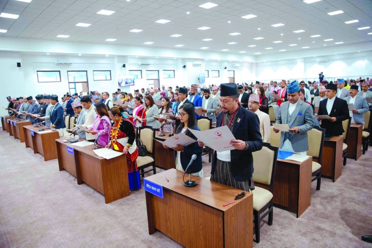 Newly elected lawmakers taking an oath during a swearing-in ceremony at the parliament in Kathmandu Thursday. (AFP)