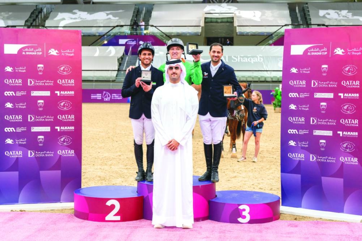 
Sheikh Talal bin Khalid al-Thani, Assistant Director of the Doha Equestrian Tour, poses with CSI5* Jump-Off 155cm class winner Gerfried Puck of Austria, runner-up Mohamad Mogheeth Alshehab of Syria and third-placed Ali al-Khorafi of Kuwait. 