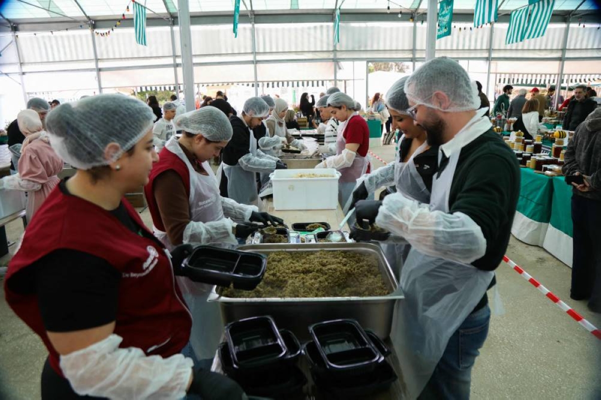 Workers and volunteers at the World Central Kitchen and GIZ NGO’s, Souk el Tayeb’s Emergency Kitchen initiative prepare meals for displaced people at their kitchen in Sin el Fil east of Beirut on March 28, 2026. The UN refugee agency warned Lebanon faced a deepening humanitarian crisis risking catastrophe, with over a mn people displaced. Lebanon was pulled into the Middle East war when Tehran-backed militant group Hezbollah fired rockets at Israel on March 2 to avenge the US-Israeli killing of Iran's supreme leader, Ayatollah Ali Khamenei. (Photo by AFP)