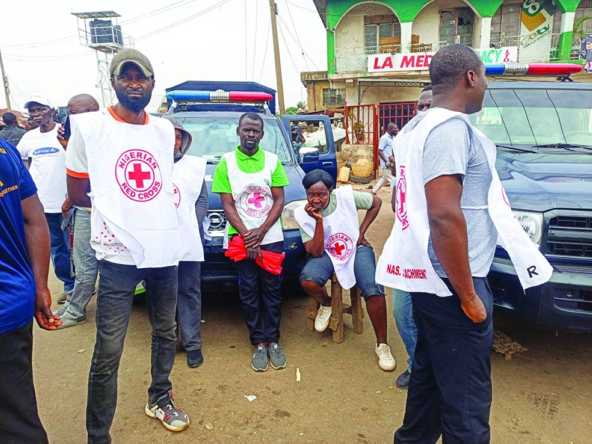Nigerian Red Cross officials look on as they arrive at the scene of an attack, the morning after gunmen killed multiple people in an overnight attack in Angwan Rukuba, Jos North, Plateau State, Nigeria, Monday.(Reuters)
