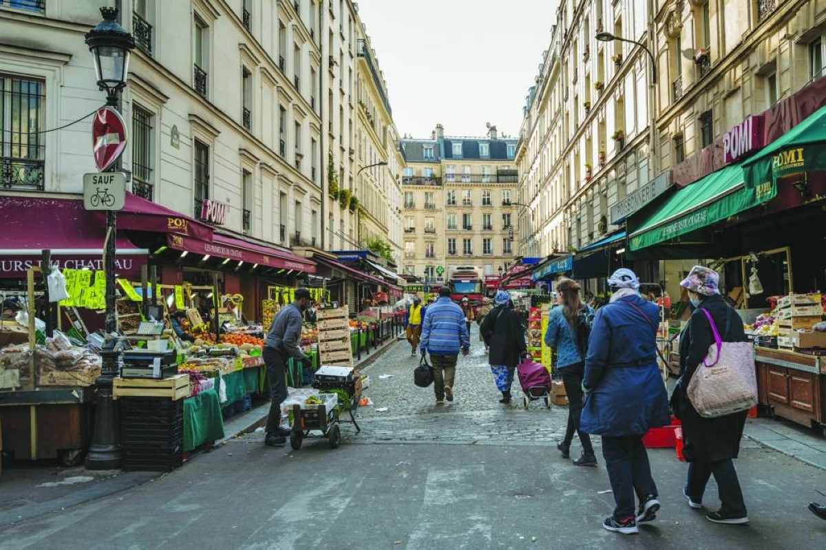 Shoppers visit a market in Paris. Eurozone inflation soared past the European Central Bank's 2% target this month as surging oil and gas ‌costs drove up headline prices, but the jump was smaller than expected and core inflation declined, muddying the picture for ​policymakers.