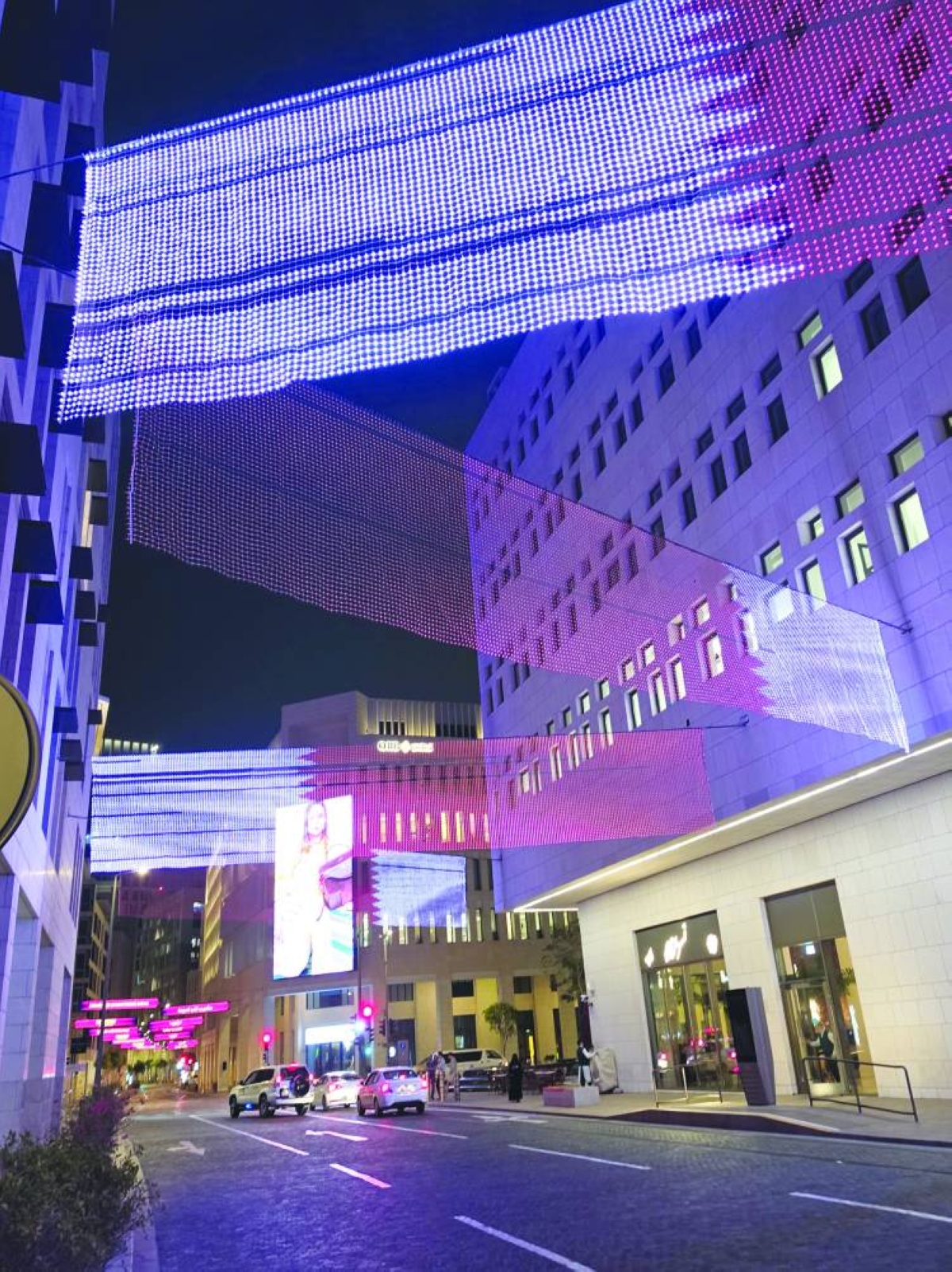 Illuminated installations resembling the Qatari flag light up streets and building facades at Msheireb Downtown Doha, as the city reflects a message of unity and national pride amid ongoing regional tensions. 
PICTURES: Joey Aguilar