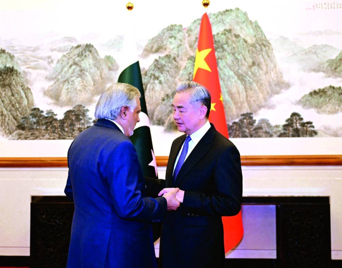 Chinese Foreign Minister Wang Yi and Pakistani Deputy Prime Minister and Foreign Minister Mohammad Ishaq Dar speak in Beijing. (Reuters)