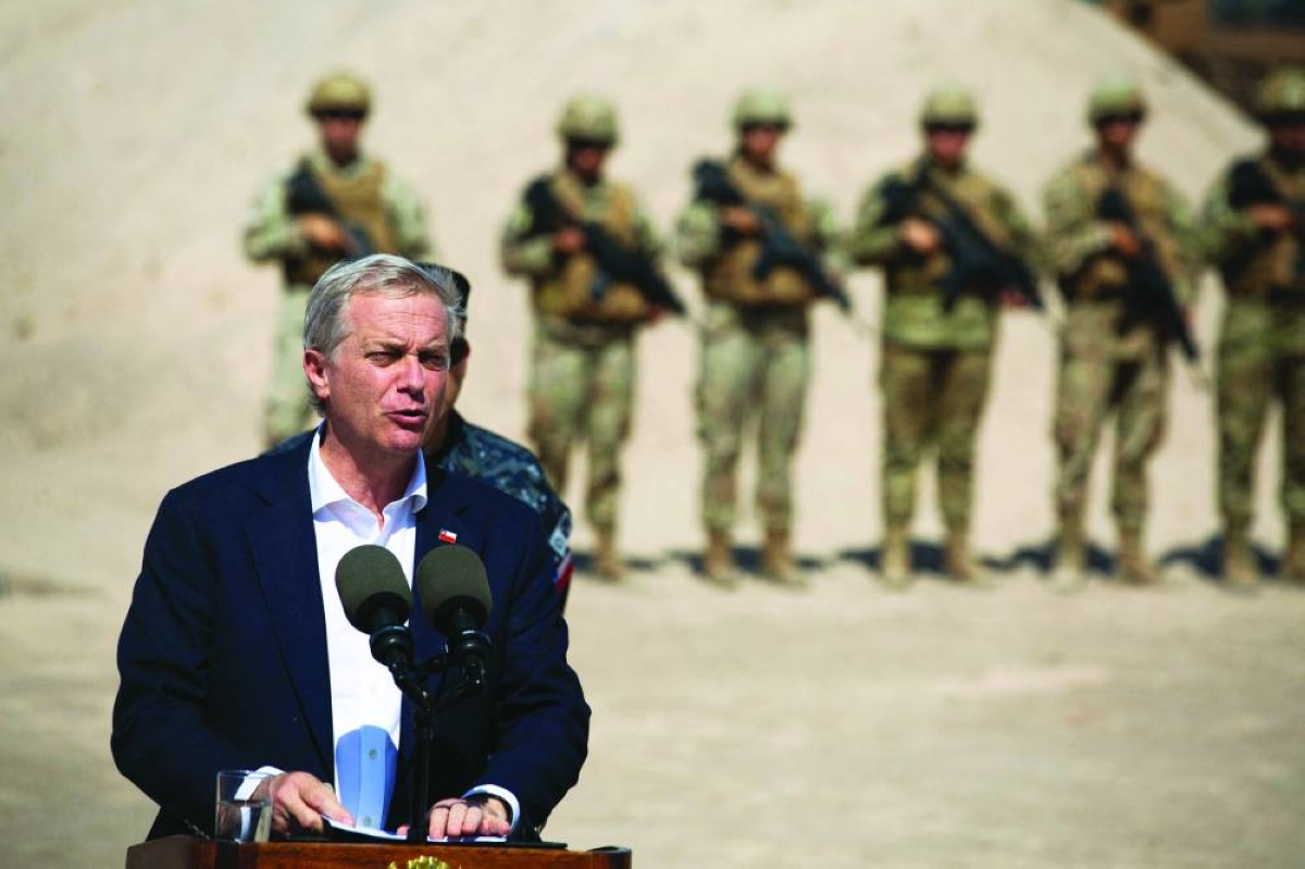 Chile’s President Jose Antonio Kast speaks next to a group of soldiers near the Chacalluta border post along the Chile-Peru border. (AFP/File photo)