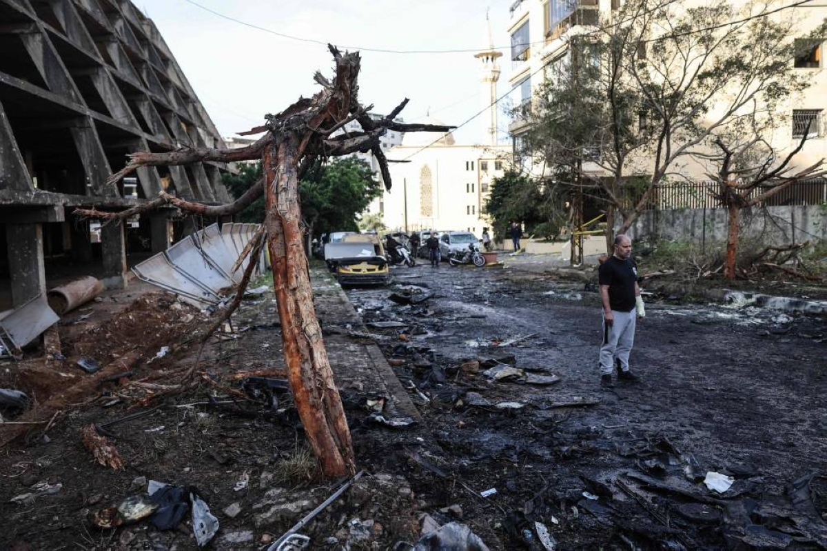 A man stands at the site of an Israeli strike in Beirut, yesterday. (AFP)
