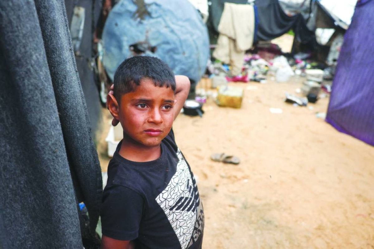 A boy stands at a makeshift camp for displaced Palestinians in the Nahr al-Bared area in Khan Yunis, in the southern Gaza Strip. AFP