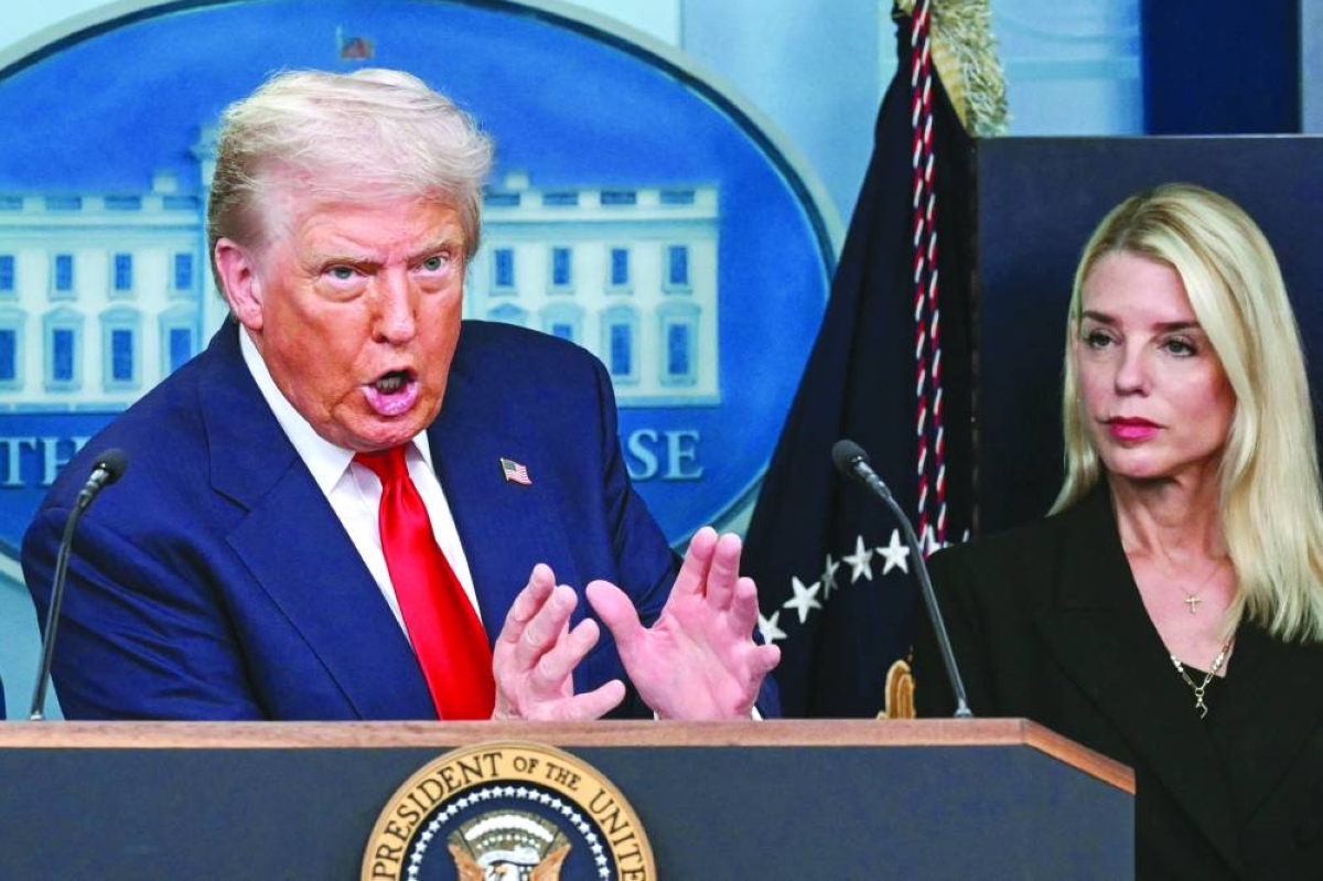  US President Donald Trump, alongside Attorney-General Pam Bondi (right), speaks during a news conference. (AFP/File photo))
