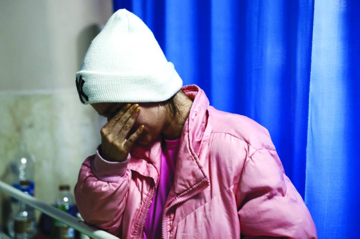 
A person reacts at Imam Ali Hospital, where people injured in a strike on the B1 bridge are being treated, amid the US-Israeli conflict with Iran, in Karaj, Iran, yesterday. (Reuters) 