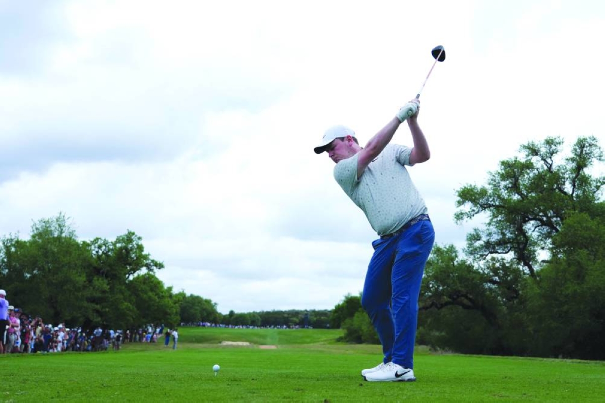 Robert MacIntyre of Scotland plays his shot from the ninth tee during the second round of the Valero Texas Open 2026 at TPC San Antonio on April 03, 2026 in San Antonio, Texas.   (AFP)