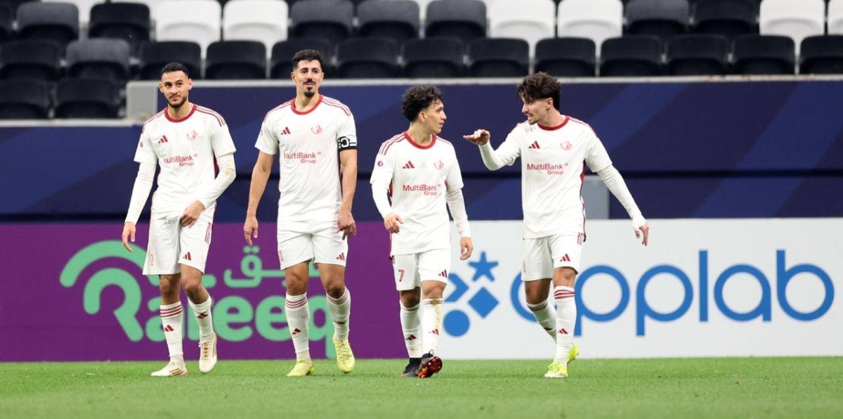 Al Shamal's Baghdad Bounedjah (second left) celebrates with teammates after scoring against Umm Salal at Al Bayt Stadium yesterday.