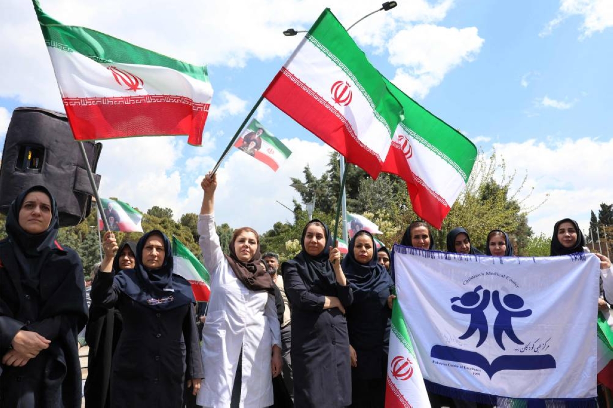 Iranian healthcare workers gather for a rally condemning attacks on health facilities by the US and Israel outside at Imam Khomeini Hospital in Tehran, yesterday. (AFP)