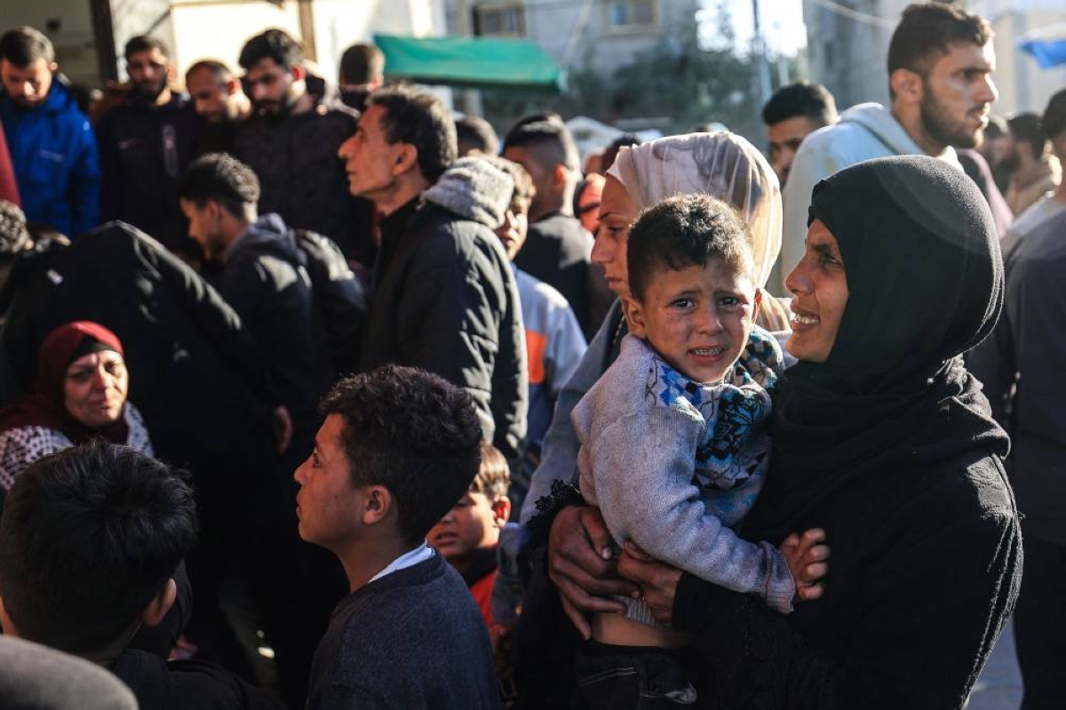 Family members arrive outside the Al-Aqsa Martyrs Hospital in Deir al-Balah, where victims have been brought following an Israeli strike on the Al-Maghazi refugee camp in the central Gaza Strip, yesterday. (AFP)