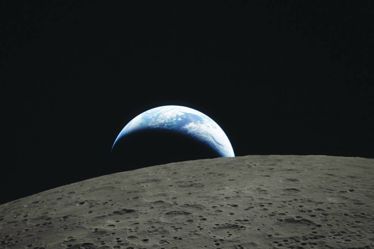 This handout picture released Tuesday by Nasa shows the Earth as it dips beyond the lunar horizon, also known as ‘Earthset’, as seen from the Orion spacecraft. AFP