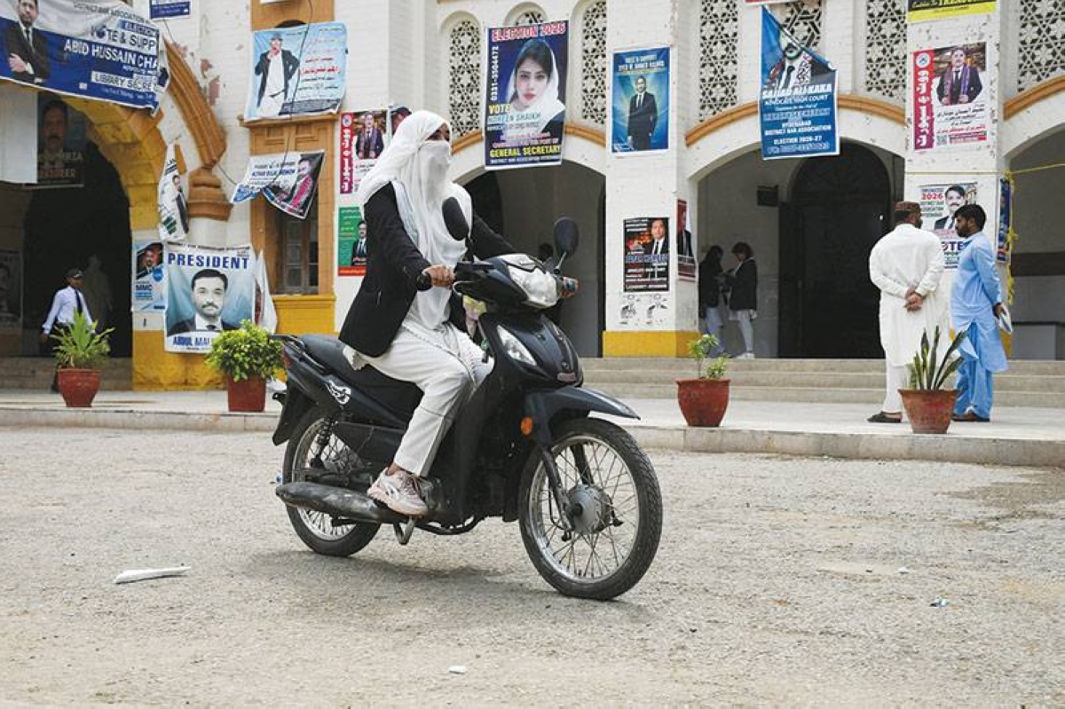 Mehwish Qureshi, 33, an advocate, rides a motorbike in Hyderabad, Pakistan.  (Reuters)