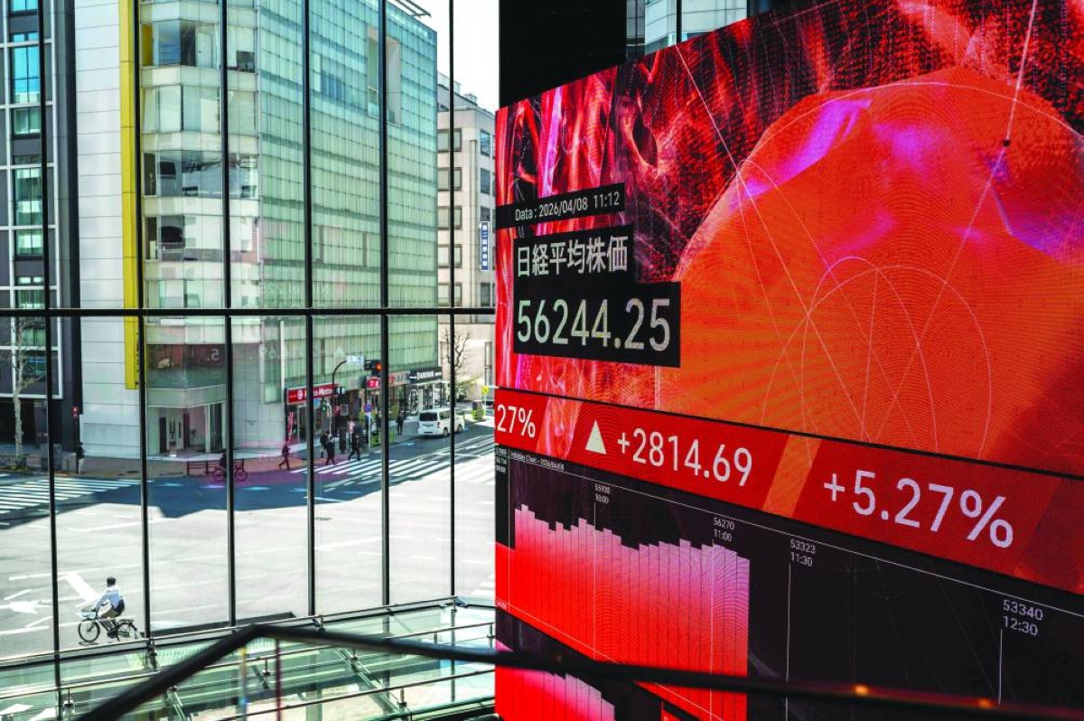 A general view shows an electronic quotation board displaying stock prices on the Tokyo Stock Exchange. The Nikkei 225 closed up 5.4% to 56,308.42 points Wednesday.