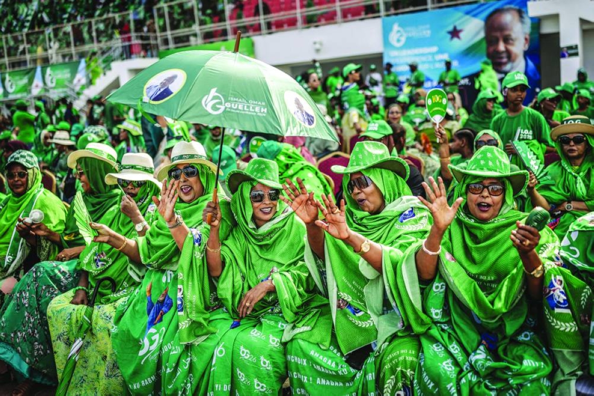 Supporters of Djibouti’s incumbent president and presidential candidate Ismail Omar Guelleh dance to traditional songs wearing outfits bearing the candidate’s image at his final campaign rally at Gouled Stadium in Djibouti. (AFP)
