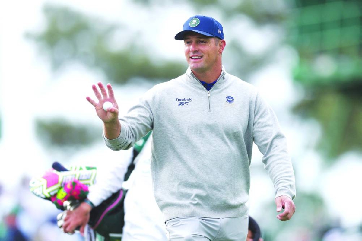 Bryson DeChambeau of the United States acknowledges a gallery of patrons while playing the third hole during a practice round prior to the 2026 Masters Tournament at Augusta National Golf Club on April 07, 2026 in Augusta, Georgia. (AFP)