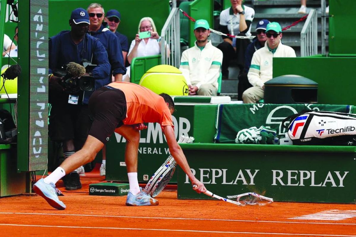 Russia's Daniil Medvedev smashes his racket on the clay as he plays against Italy's Matteo Berrettini during the Monte Carlo ATP Masters Series Tournament round of 32 tennis match on Court Rainier III at the Monte-Carlo Country Club in Roquebrune-Cap-Martin, south-eastern France on April 8, 2026. (AFP)