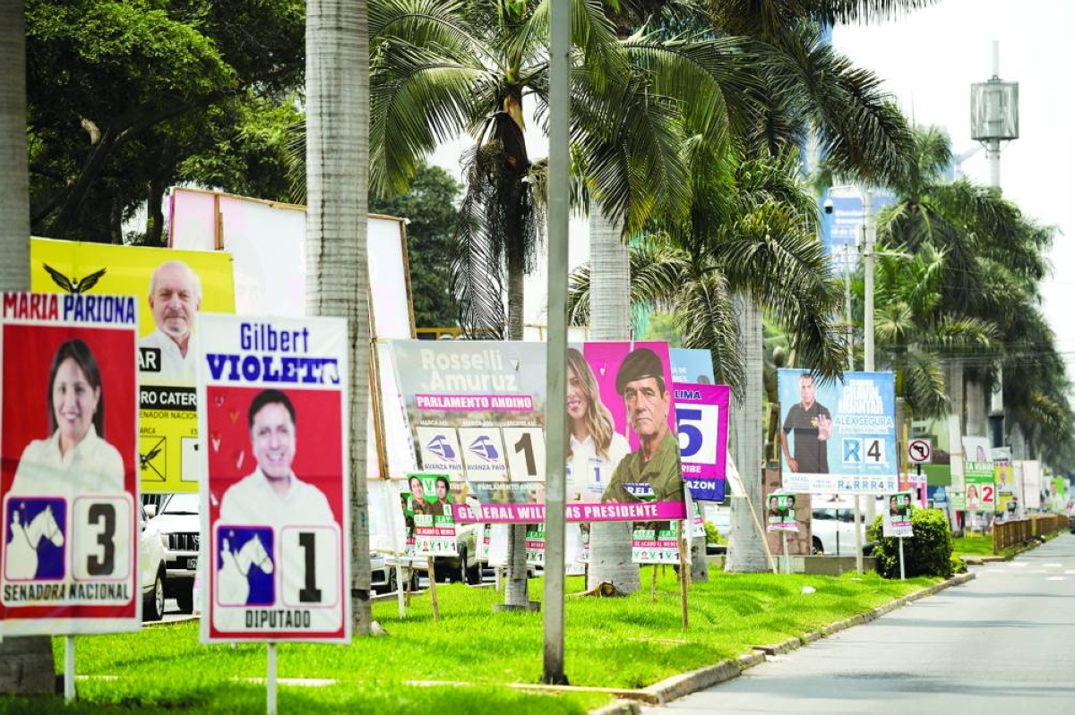Political advertising is on display ahead of the April 12 general election, in Lima, Peru,on Wednesday. (Reuters)
