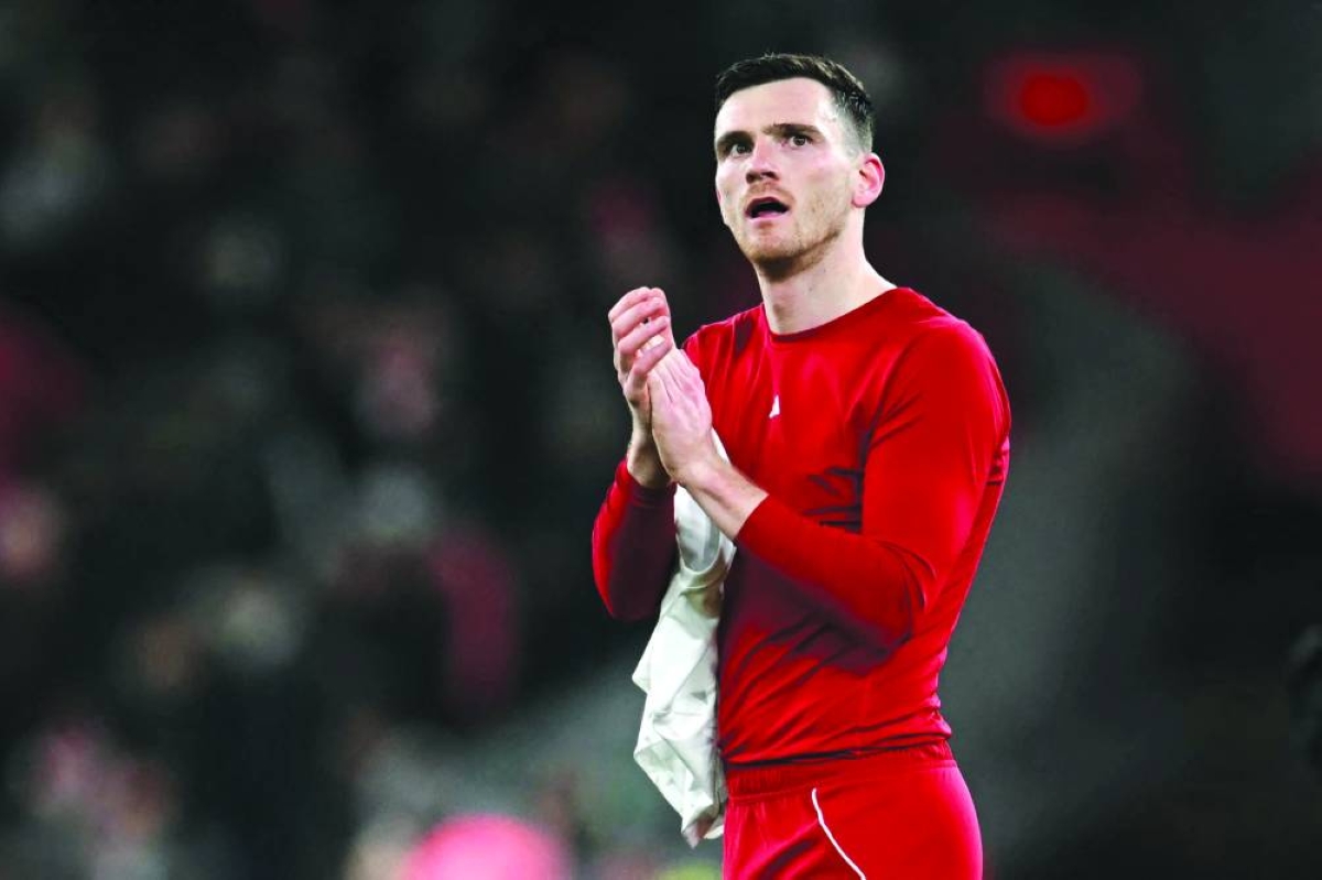 (FILES) Liverpool's Scottish defender #26 Andrew Robertson applauds the fans following the UEFA Champions League football match between Liverpool and Qarabag at Anfield in Liverpool, north west England on January 28, 2026. Left-back Andy Robertson will leave Liverpool at the end of this season, the faltering Premier League champions announced April 9, 2026. Since signing from Hull in 2017, the 32-year-old has made 373 appearances for the Reds, winning two Premier League titles, a Champions League, the FA Cup and two League Cups, as well as the FIFA Club World Cup and UEFA Super Cup. (AFP)