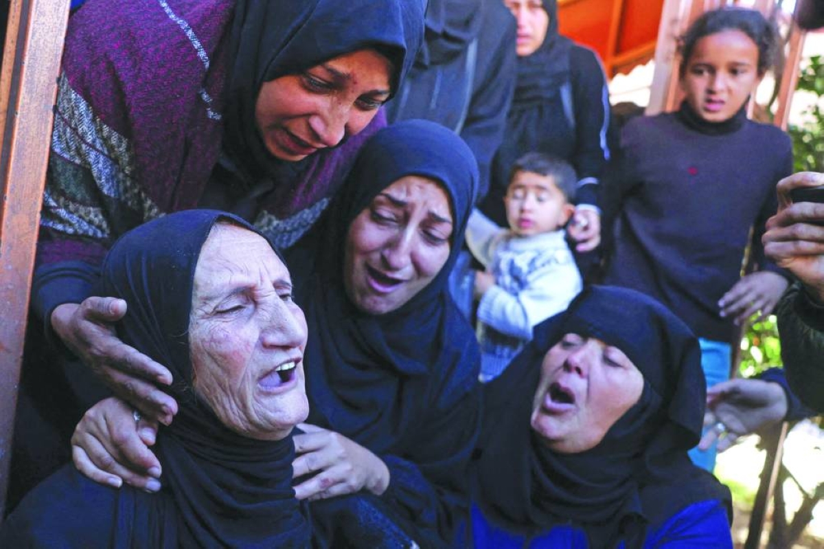 
Family members and friends mourn outside the Nasser Hospital, the day after a Palestinian was killed in an Israeli strike in Khan Yunis, in the southern Gaza Strip, yesterday. (AFP) 
