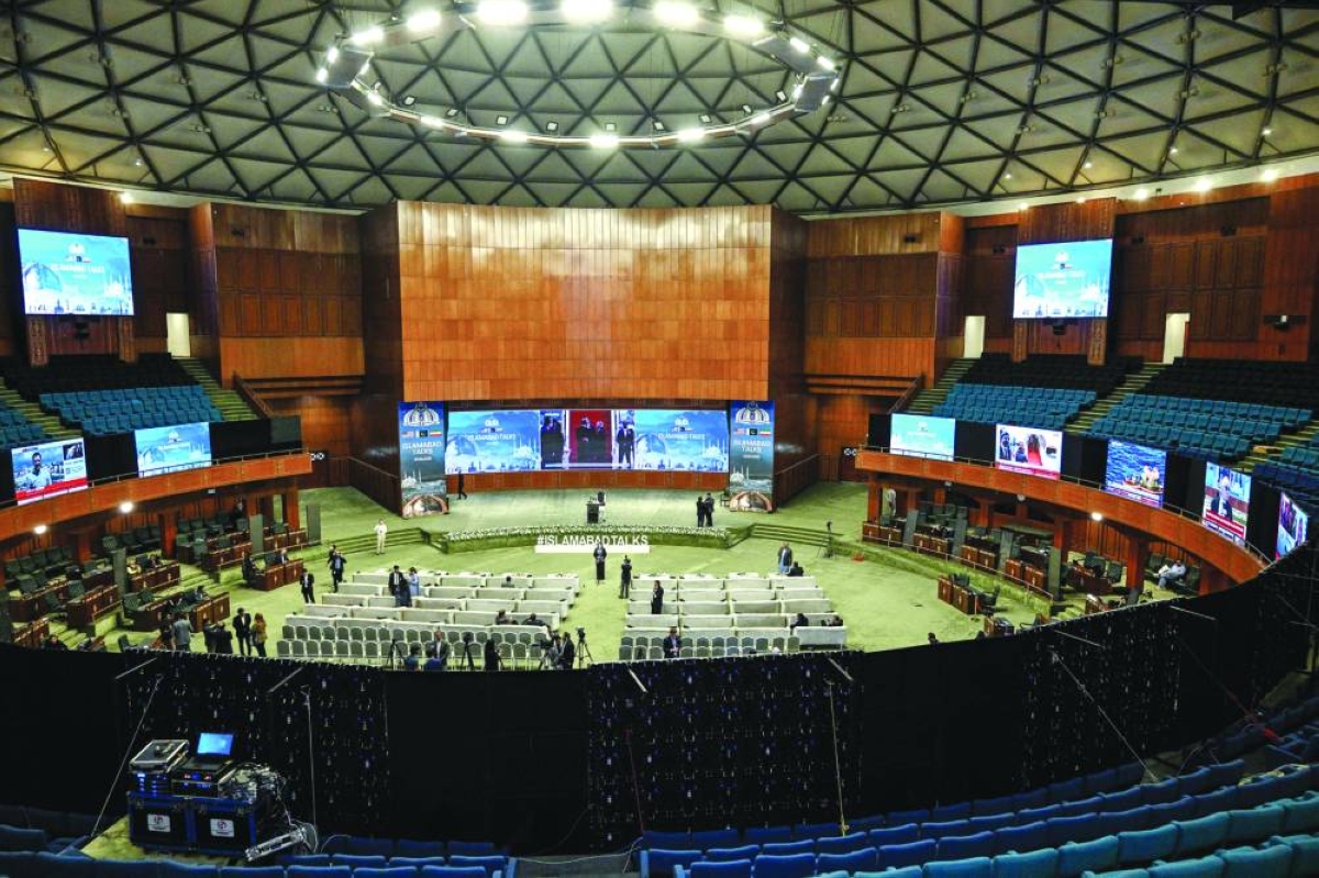 Journalists work at a media facilitation center ahead of US-Iran peace talks in Islamabad on April 11, 2026. US Vice President JD Vance arrived in Islamabad on April 11 for talks with Iran that the Pakistani premier hosting the warring sides called a "make or break" effort to permanently halt weeks of fighting in the Middle East. (AFP)