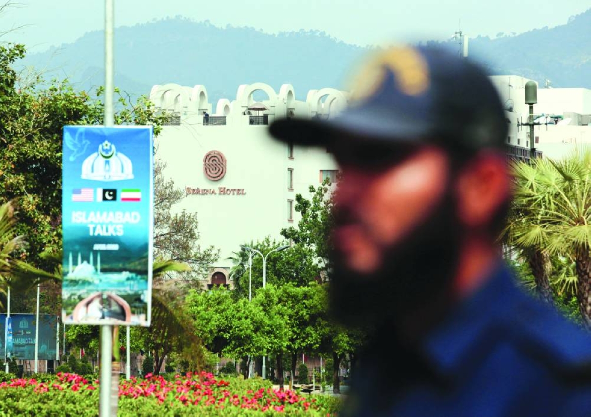 A security officer stands guard outside the media centre near the road leading to Serena Hotel in Islamabad. – Reuters