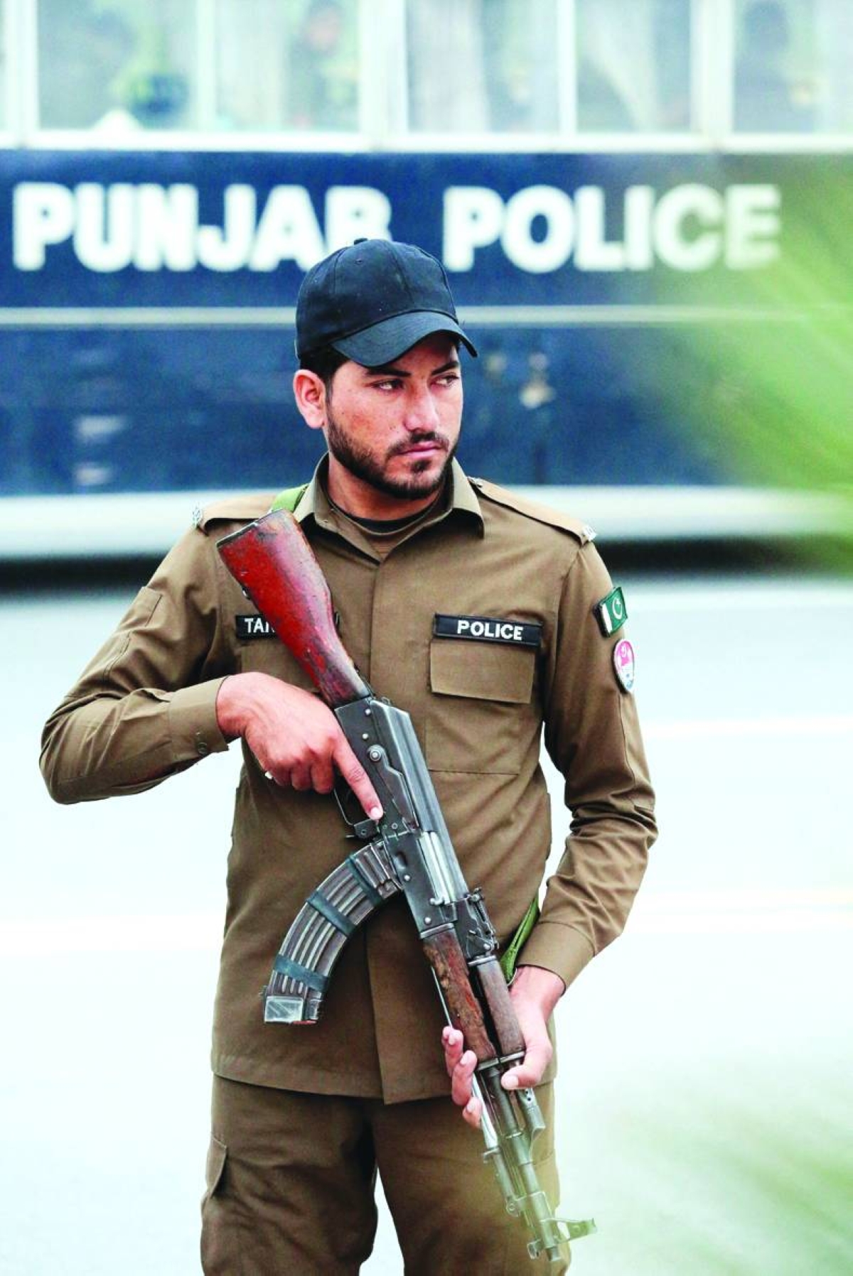A police officer stands guard on a road leading to Serena Hotel in Islamabad. – Reuters