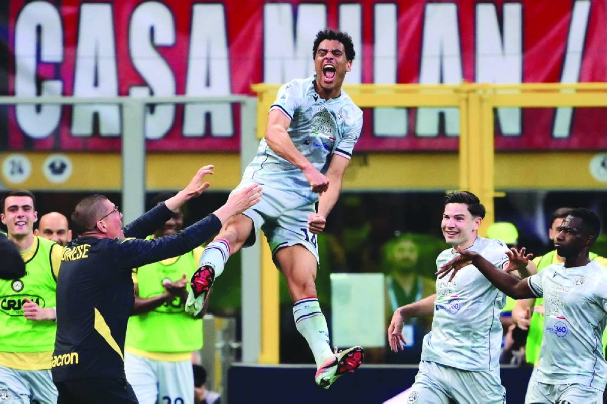 
Udinese’s Arthur Atta celebrates after scoring a goal during the Serie A match against AC Milan at the San Siro stadium in Milan. (AFP) 