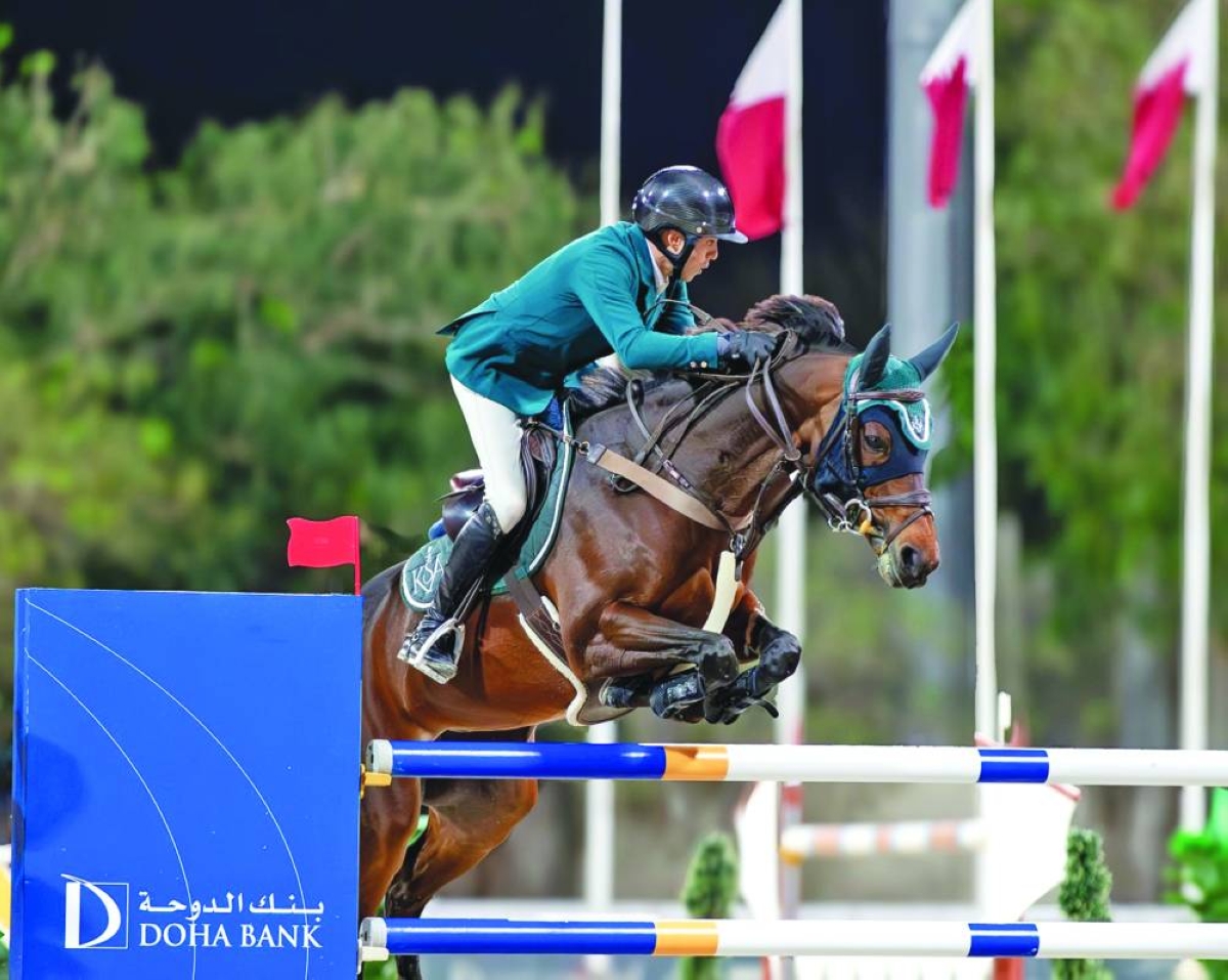 Saudi Arabia's Abdullah Alsharbatly astride Frenchy Vds clears a rail during the tenth round of the Longines Hathab Qatar Equestrian Tour at the Qatar Equestrian Federation's (QEF) main arena Saturday.