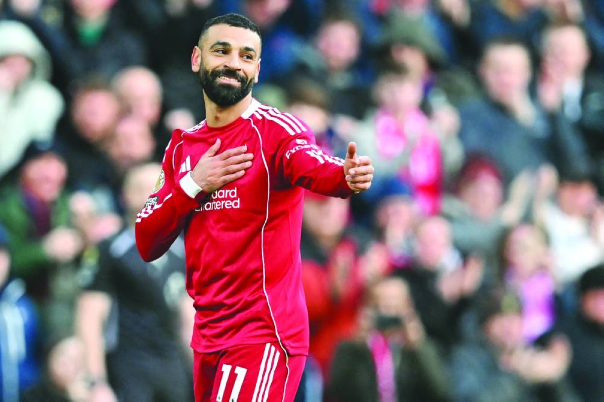 Liverpool’s forward Mohamed Salah celebrates after scoring against Fulham at Anfield in Liverpool. (AFP)