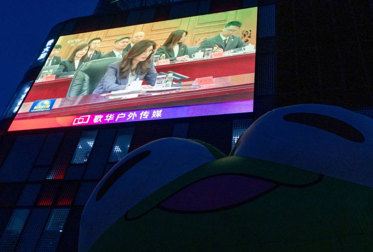 A giant screen broadcasting news showing Cheng Li-wun speaking during her meeting with Chinese President Xi Jinping at the Great Hall of the People in Beijing, China, on Friday. (Reuters)