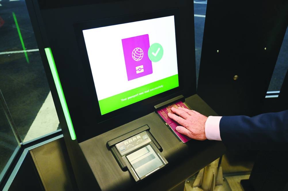 An employee scans a passport during a demonstration of the new Entry/Exit System at the Eurotunnel terminal in Folkestone, UK.