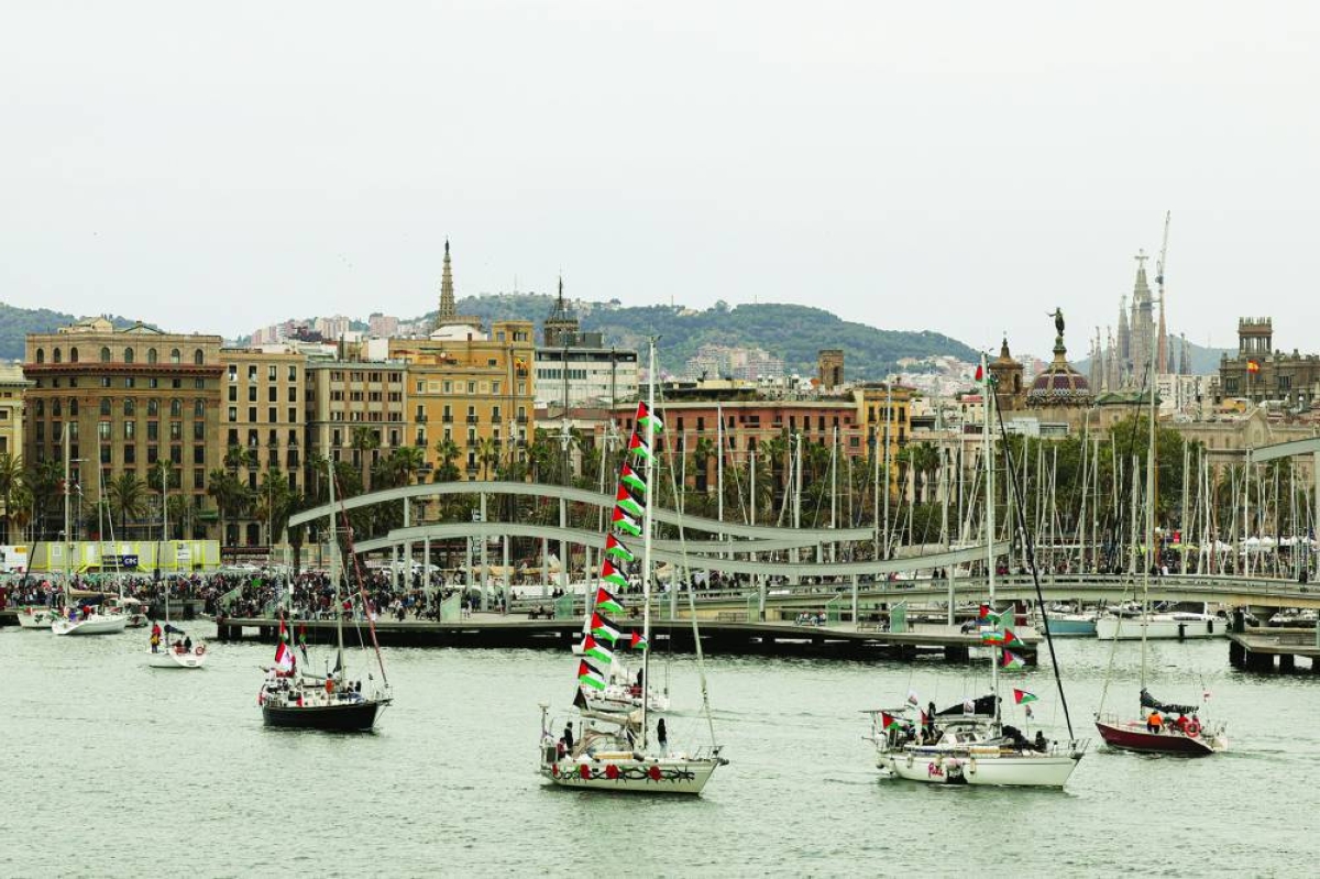 Boats taking part in a humanitarian flotilla depart for Gaza from Barcelona, Spain, April 12, 2026. REUTERS
