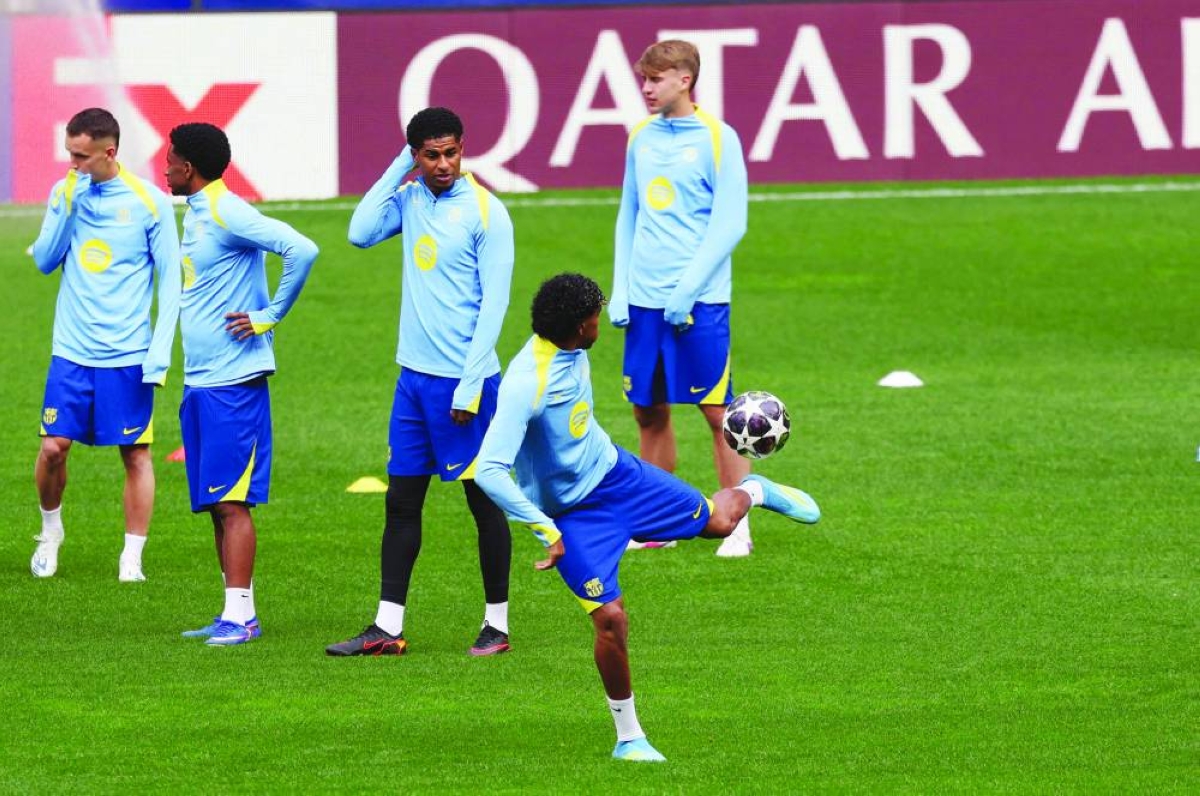 Barcelona's Spanish forward #10 Lamine Yamal plays with the ball during a training session on the eve of their UEFA Champions League quarter final second leg football match against Club Atletico de Madrid at Metropolitano Stadium in Madrid, on April 13, 2026. (AFP)