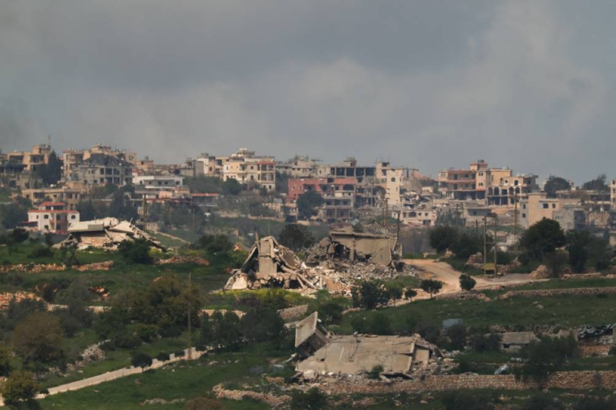 Destroyed buildings in Bint Jbeil, southern Lebanon, near the border, as seen from the Israeli side of the border in northern Israel, yesterday. (Reuters)