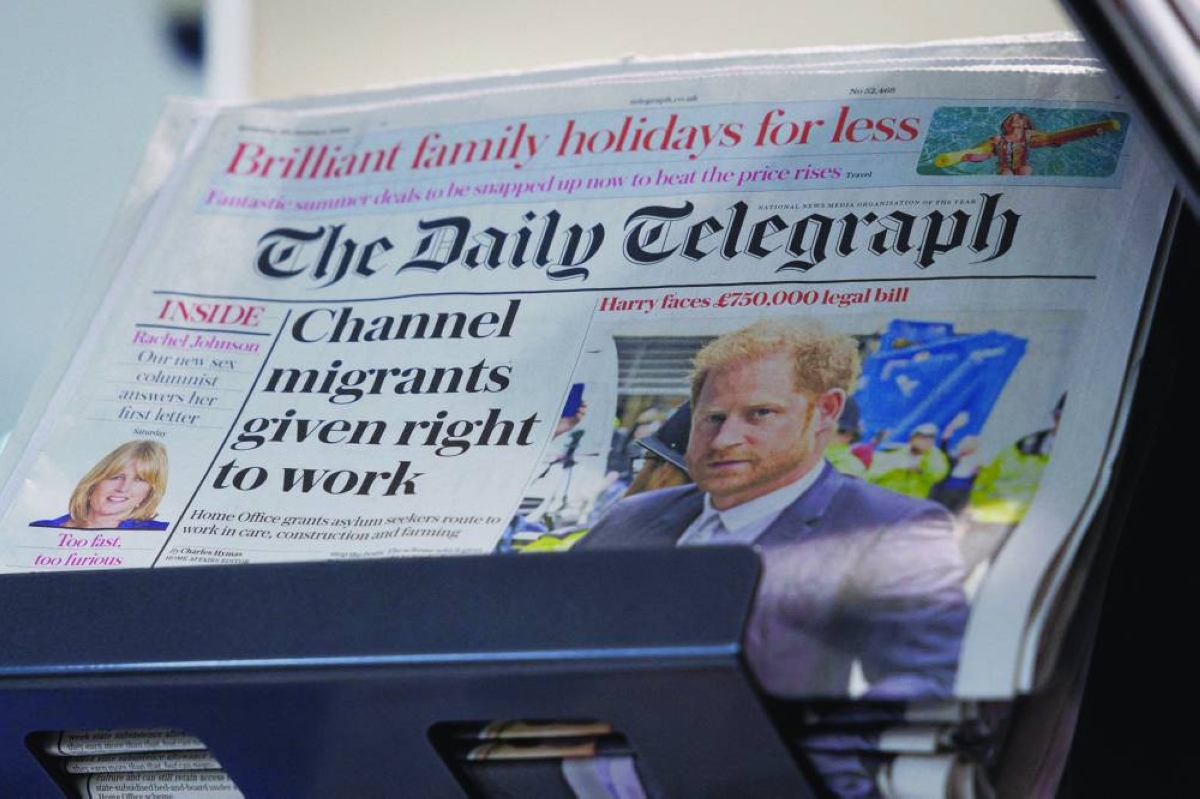 Copies of The Daily Telegraph are displayed on a rack in a supermarket in London. (Reuters/File Photo)