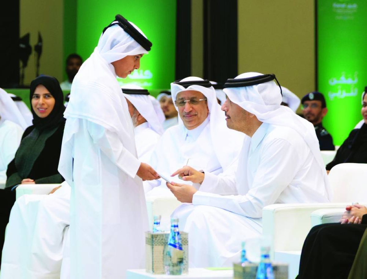 His Excellency Prime Minister and Minister of Foreign Affairs Sheikh Mohammed bin Abdulrahman bin Jassim al-Thani interacting with a child at the launch.