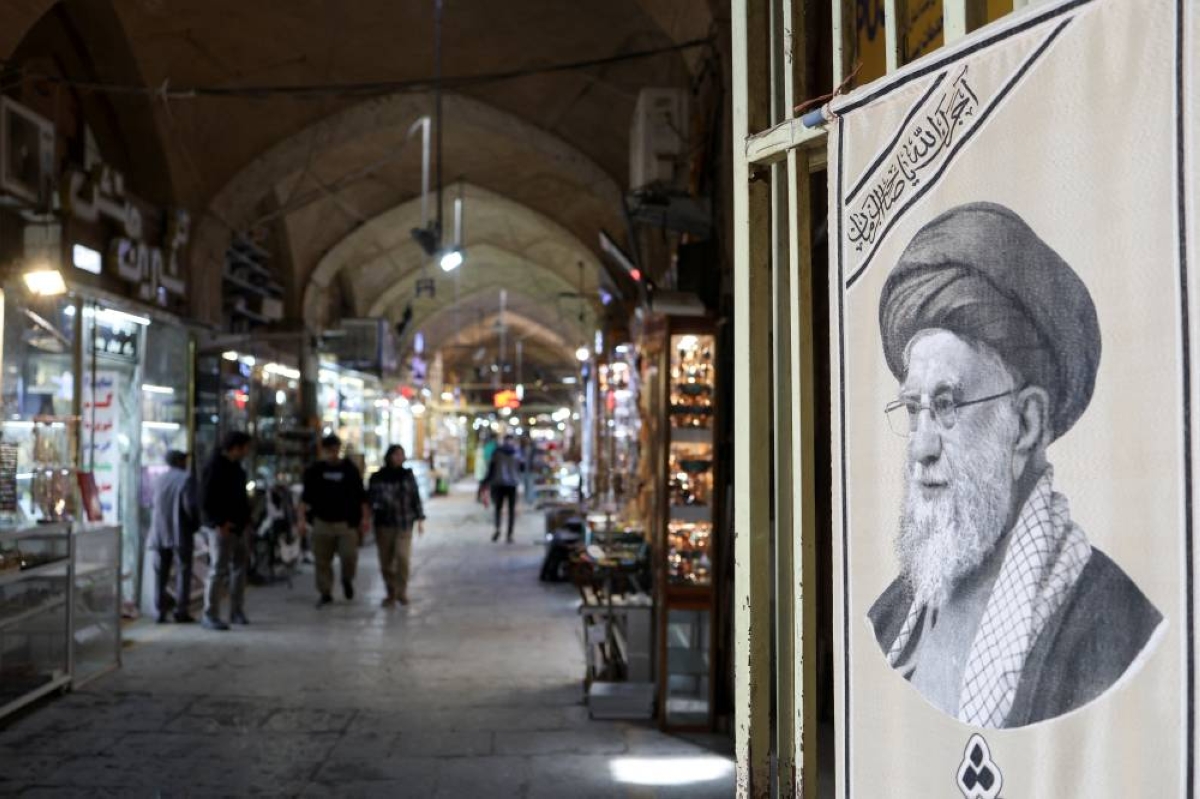 A poster of Iran’s late Supreme Leader Ayatollah Ali Khamenei hangs along a corridor at the Grand Bazaar in Isfahan, Iran, March 24, 2026. REUTERS/Alaa Al Marjani