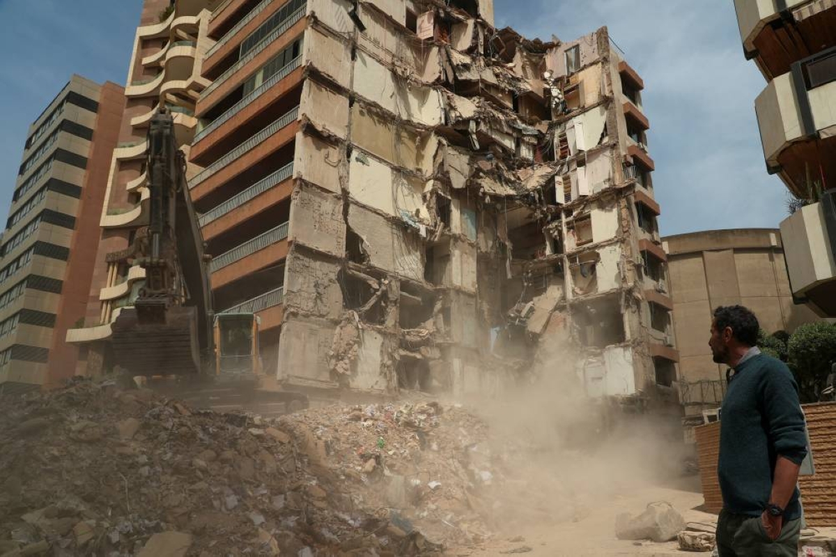 Wael Sabbagh, whose mother Afaf Sidaoui and brother Hassan, were killed in an Israeli strike on an apartment building on April 8, stands at the strike site in Tallet El Khayat in Beirut, Lebanon, April 15, 2026. REUTERS/Jihed Abidellaoui