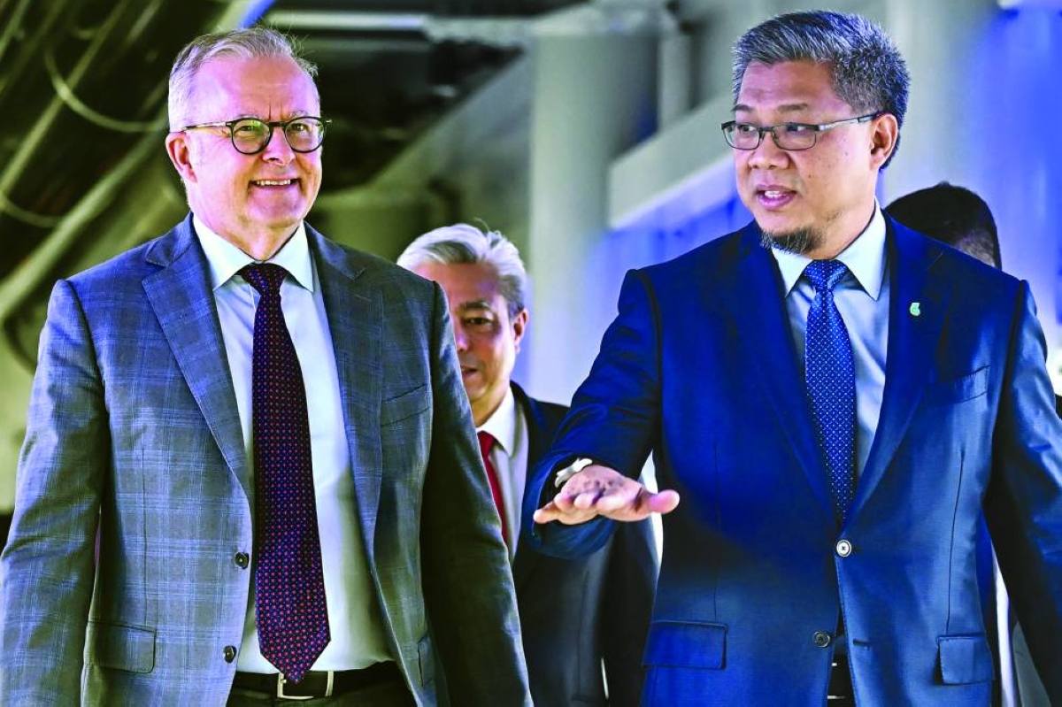 Australia's Prime Minister Anthony Albanese (left) walking with Petronas Chief Operating Officer, Executive Vice-President and CEO of Upstream Mohd Jukris Abdul Wahab at the Petronas Twin Towers in Kuala Lumpur Thursday. (AFP)